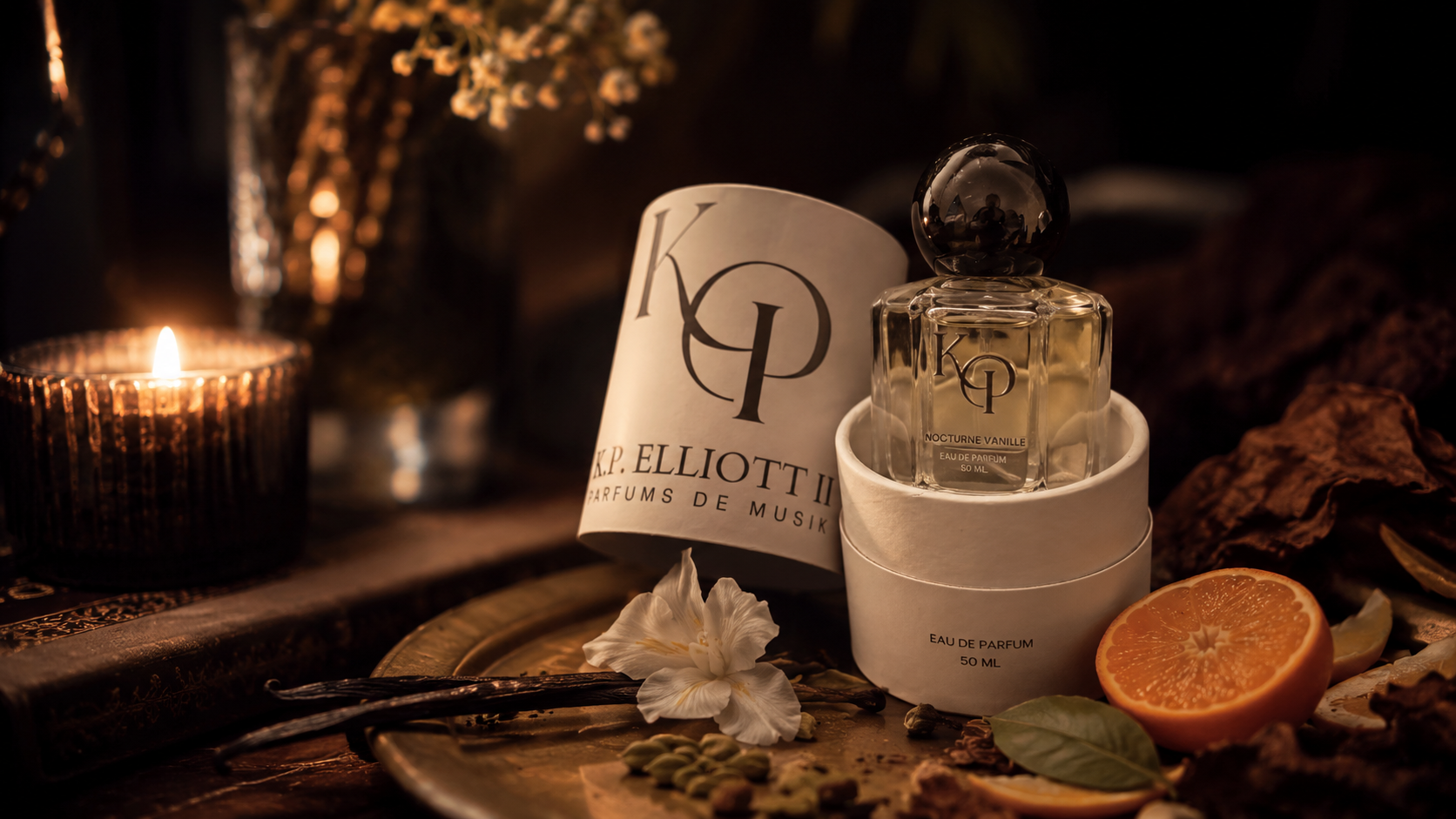 Nocturne Vanille candlelit still life with vanilla beans and orange